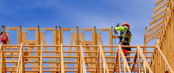 Construction on New Home or Residential Building Wooden Beams and Sky