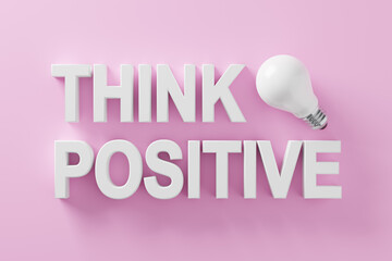Positive thinking and optimism in business or life concept. The word think positive with an idea light bulb on pink background.