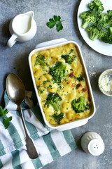 Mac and cheese with broccoli ( baked pasta with cream sauce ) . Top view with copy space.