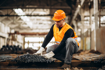 Man worker at a steel factory