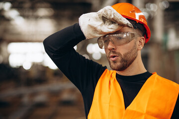 Man tired at steel factory