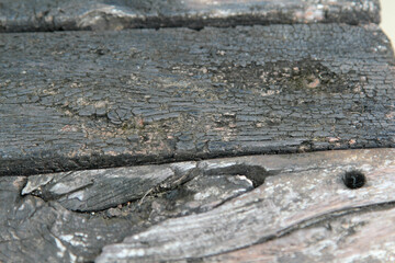 The old wooden with burn marks texture background