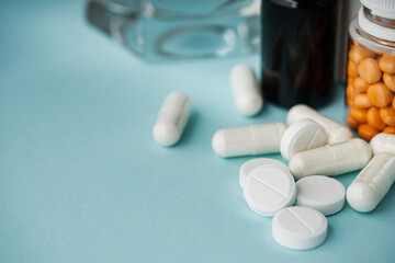 various medicines on a blue paper background