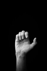 Hand demonstrating the Japanese sign language letter 'E' or 'ぇ' with copy space