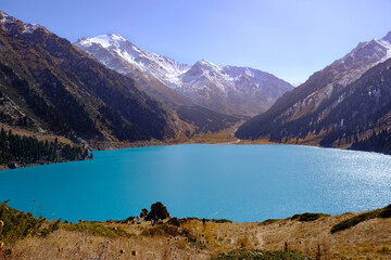 Fototapeta na wymiar Amazing mountain lake with turquoise water, Big Almaty lake. 
