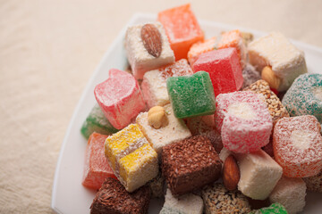 A variety of colored Arabic and Turkish sweets on a plate