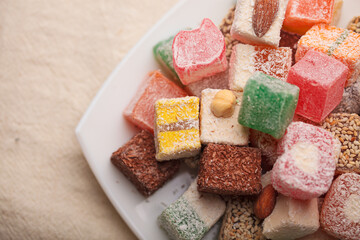 A variety of colored Arabic and Turkish sweets on a plate