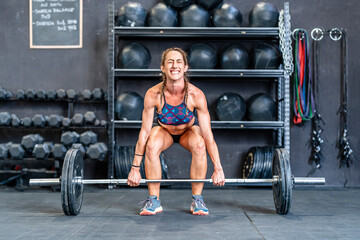 Sportswoman doing barbell front squat