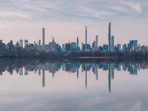 Fototapeta Calm lake in city park in evening