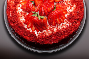 Beautiful red cake with strawberries and cream