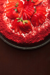 Beautiful red cake with strawberries and cream