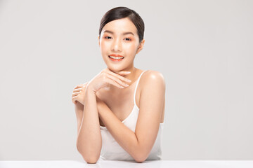 Obraz na płótnie Canvas Beautiful Asian young woman touching chin smile with clean and fresh skin Happiness and cheerful with positive emotional,isolated on white background,Beauty Cosmetics and spa Facial treatment Concept