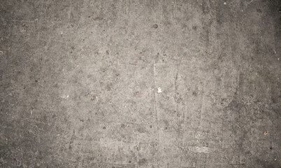 Textura de un suelo de cemento viejo con desgaste color gris y manchas ideal para fondos 