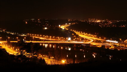 Fototapeta na wymiar Night-lit large intersection on the highway ring, Barrandovsk most in Prague
