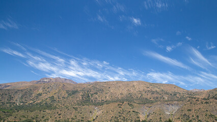 Landscape with blue sky and clouds in Cajon del Maipo in Chile