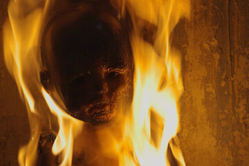 plastic doll burns with bright fire