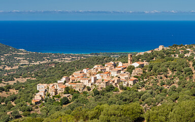 The mountain village of Aregno in Balagne region of Corsica with Mediterranean sea in the distance,...