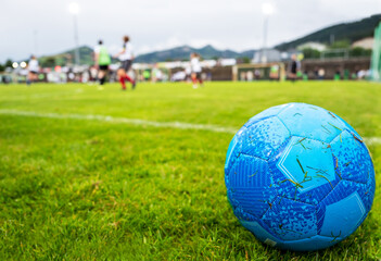 Soccer ball and soccer field background
