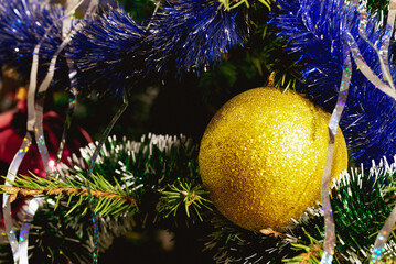 Decoration in the form of a ball on a festive tree