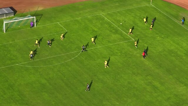 Soccer championship match on a stadium. Teams play on major league football tournament, cup broadcast. Sport channel television playback, screen content. Moving aerial drone shot