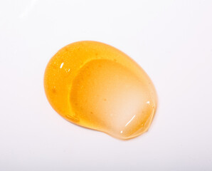 Gold skincare texture swatches. Golden swatch on white background.