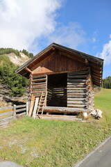 an old little crooked hut in the alps
