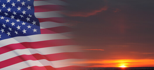 United States of America flag on sky at sunset or sunrise background. Independence day, Memorial day, Veterans day. Banner.