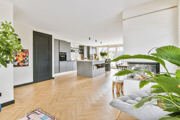 Couches and table located near TV against dining area of spacious room in contemporary apartment