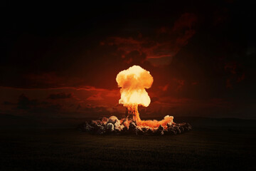 Terrible bright nuclear explosion in the evening field. World war 3. Apocalypse, creative idea. Concept of nuclear catastrophe. H-bomb danger. Radiation and explosion. Nuclear mushroom