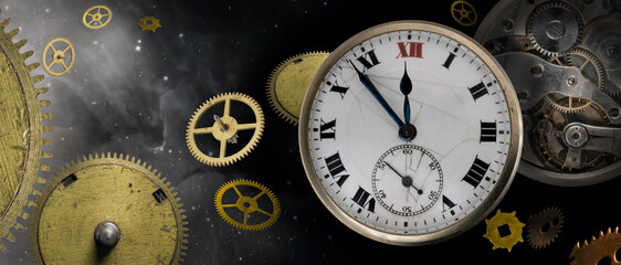 An old antique clock with roman numerals on the dial and clockwork with different parts. Isolated on night starry sky