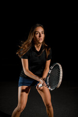 Great close-up of athletic woman with racket in special pose which preparing to playing tennis