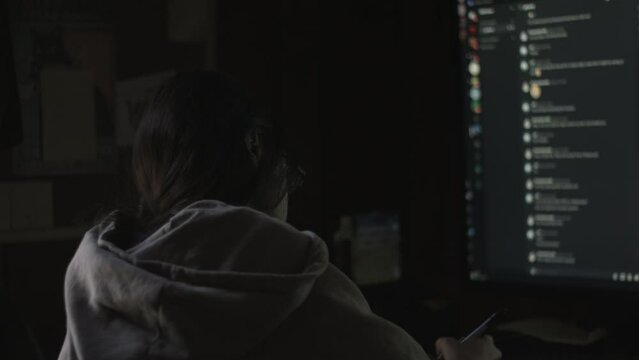 Young Female Office Employee Carries Out Daily Tasks at Her Desk 4K