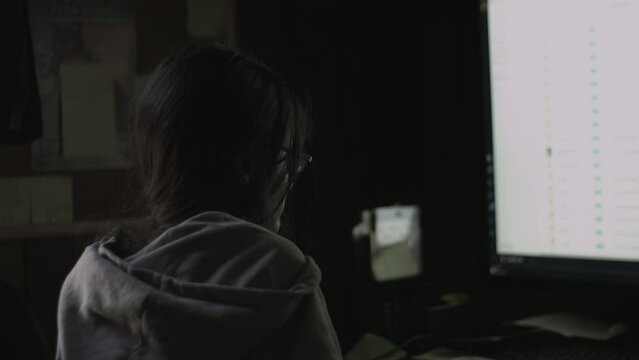 Young Female Office Employee Carries Out Daily Tasks at Her Desk 4K