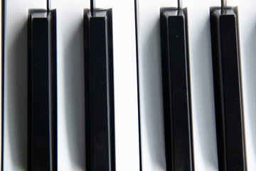 white and black piano wedge with shadow