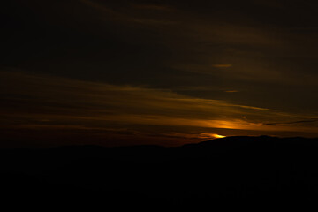 Sunset in mountains in summer landscape