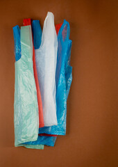 Many Plastic Bags on Brown Background. Old Crumpled Plastic Bag, Used Cellophane Packaging Waste, Shopping Disposable Pouch