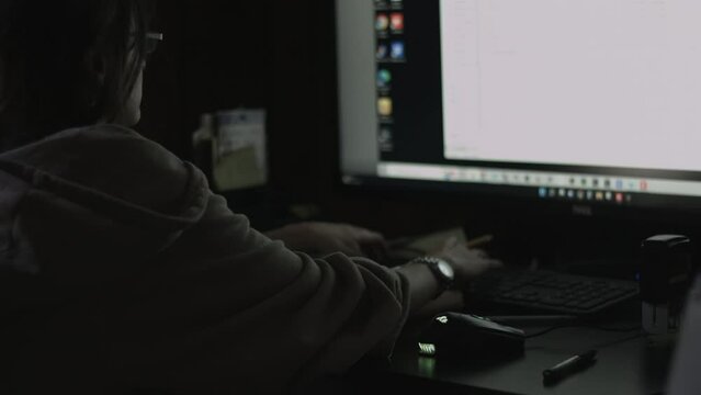 Young Female Office Employee Carries Out Daily Tasks at Her Desk 4K