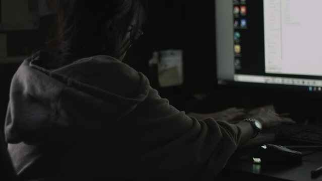 Young Female Office Employee Carries Out Daily Tasks at Her Desk 4K