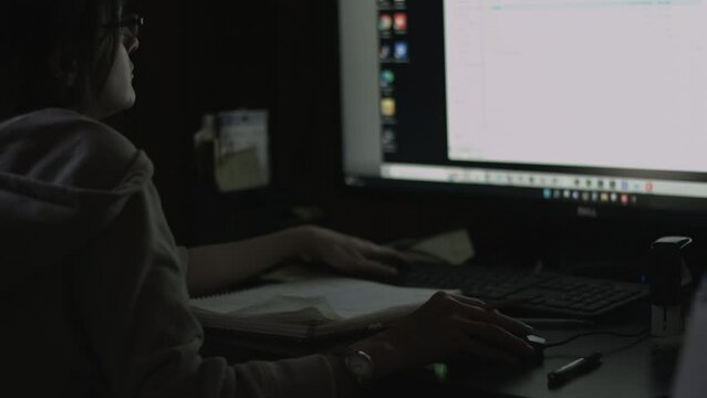 Young Female Office Employee Carries Out Daily Tasks at Her Desk 4K