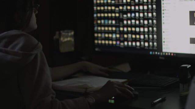 Young Female Office Employee Carries Out Daily Tasks at Her Desk 4K