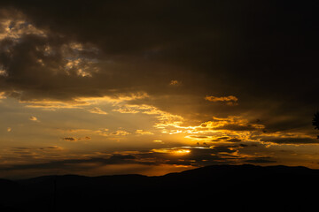 Sunset in mountains in summer landscape
