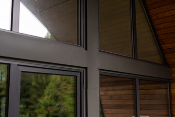 Modern widow glass with black aluminium frame in house, Modern house