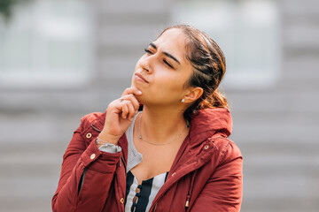 girl with thoughtful expression outdoors