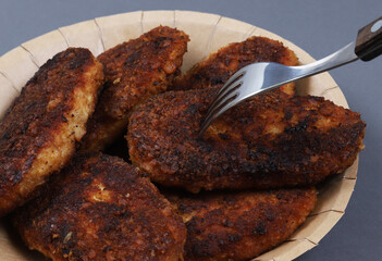 Homemade cutlets on a fork. Close-up