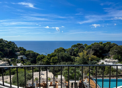 Capri resort pool overlooks Mediterranean and shoreline forests