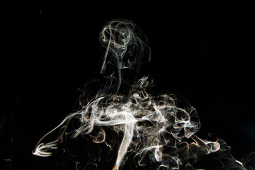 Smoke effect texture. Isolated background. Black and dark backdrop. Smokey fire and mistic effect.