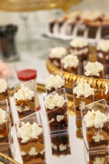 Festive sweet table. Cakes, cookies, fruits and mousses. Buffet table