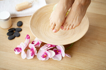 Obraz na płótnie Canvas Closeup Photo of a Female Feet at Spa Salon on Pedicure Procedure.