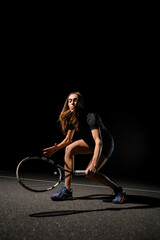 Attractive sportswoman playing tennis. Training, practicing in motion, action.