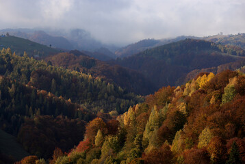 Amazing autumn landscape over Rucar Bran Pass between Bucegi and Piatra Craiului Mountains.